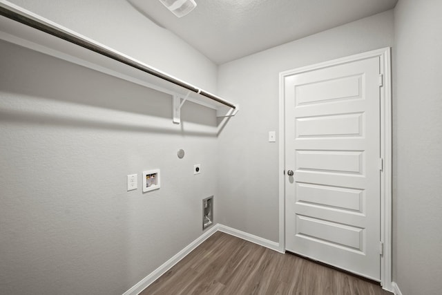 1372 Mount Blanc Path, Conroe, TX 77301 - clothes washing area with laundry area, baseboards, dark wood-style floors, electric dryer hookup, and washer hookup