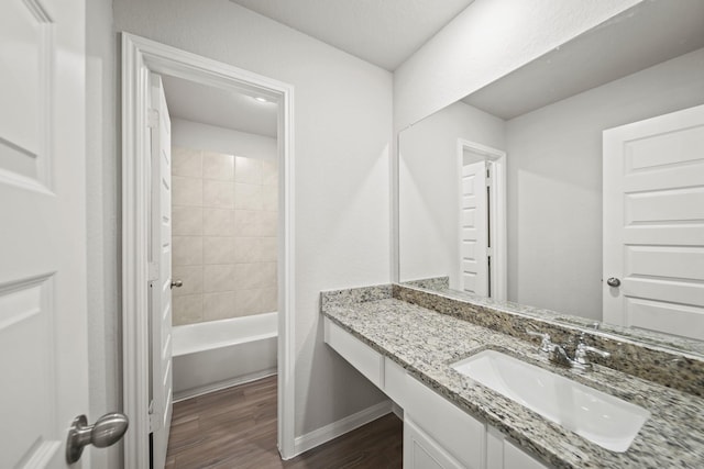 1372 Mount Blanc Path, Conroe, TX 77301 - full bathroom with baseboards, washtub / shower combination, wood finished floors, and vanity