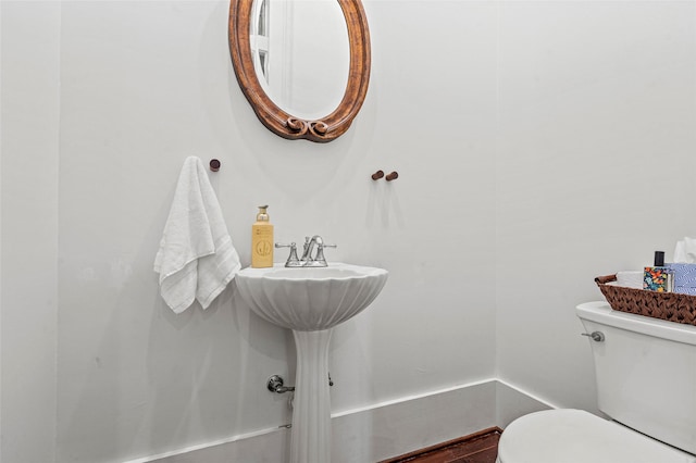 half bathroom with toilet