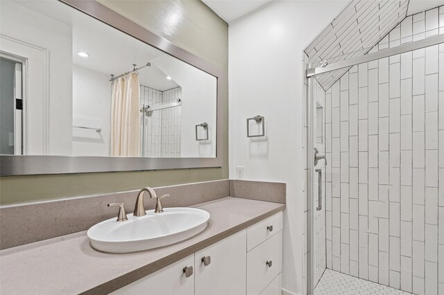 full bathroom featuring recessed lighting, a shower stall, and vanity