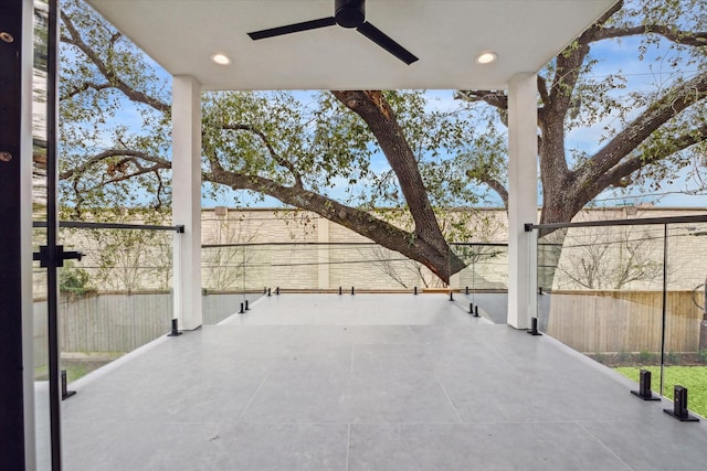 view of patio featuring fence and a ceiling fan