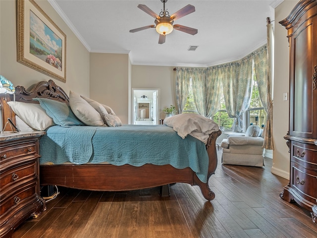 bedroom with crown molding, a ceiling fan, visible vents, and dark wood-type flooring