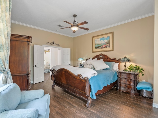 bedroom with crown molding, ceiling fan, baseboards, wood finished floors, and visible vents