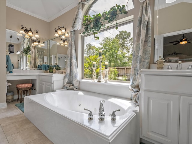 bathroom featuring ornamental molding, a jetted tub, tile patterned flooring, and vanity