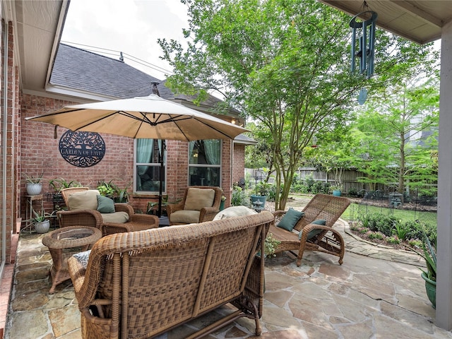 view of patio / terrace featuring fence and an outdoor hangout area