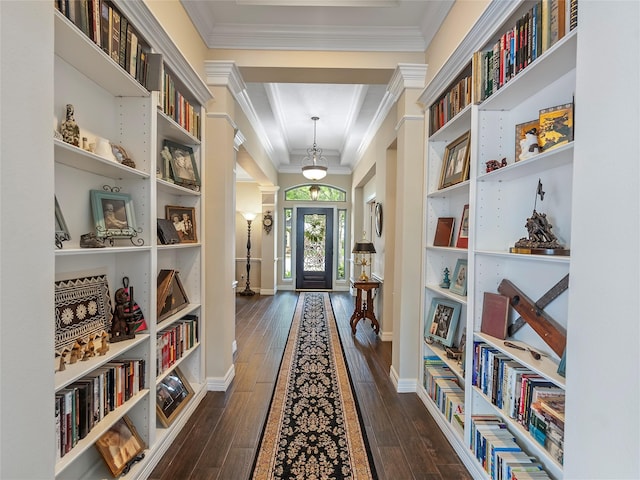 hall with crown molding, dark wood finished floors, and baseboards