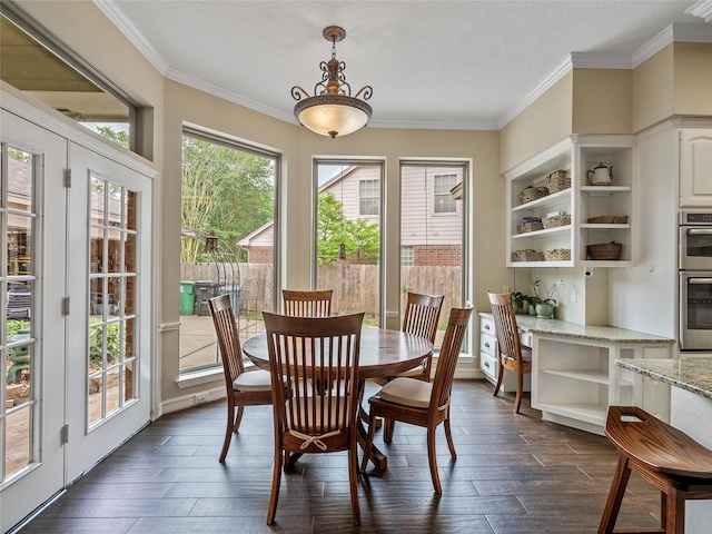 dining area with ornamental molding and dark wood-style flooring
