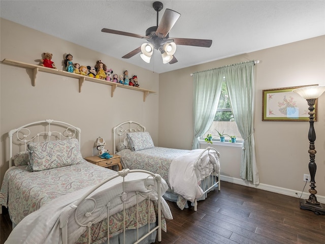 bedroom with a ceiling fan, baseboards, and hardwood / wood-style floors
