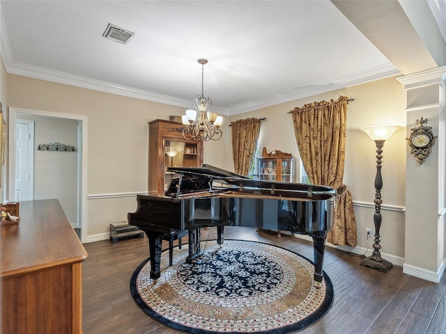 sitting room with baseboards, an inviting chandelier, and dark wood-style floors