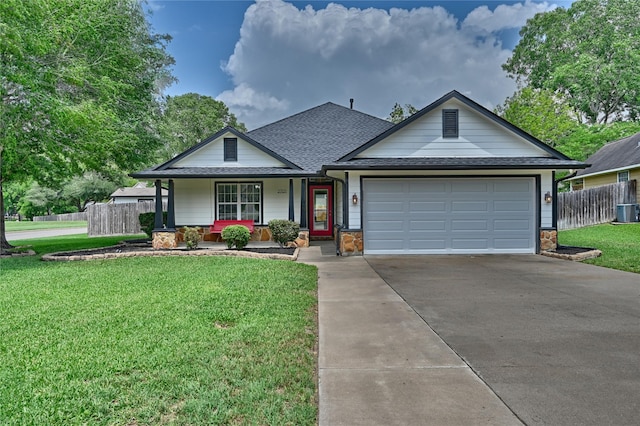 view of front of home featuring fence, covered porch, and a front yard