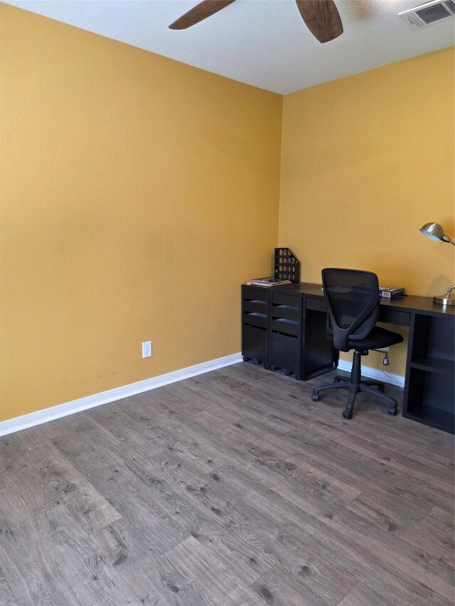 2701 Cypress Cir, Brenham, TX 77833 - office featuring baseboards, ceiling fan, visible vents, and wood finished floors