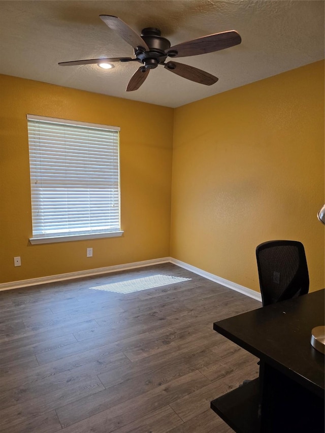 2701 Cypress Cir, Brenham, TX 77833 - unfurnished office with baseboards, ceiling fan, and wood finished floors