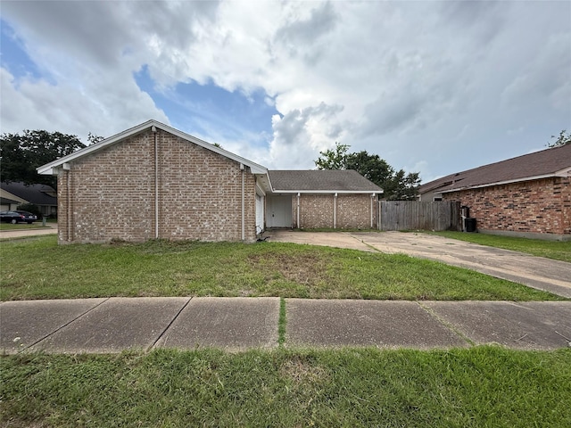 6410 Rancho Blanco Ct, Houston, TX 77083 - view of side of property featuring concrete driveway, brick siding, and an attached garage
