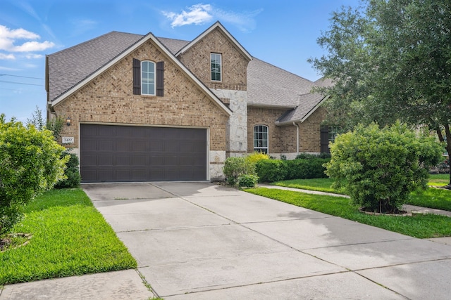 3422 Leaning Willow Dr, Katy, TX 77494 - traditional home with brick siding, a garage, roof with shingles, and concrete driveway