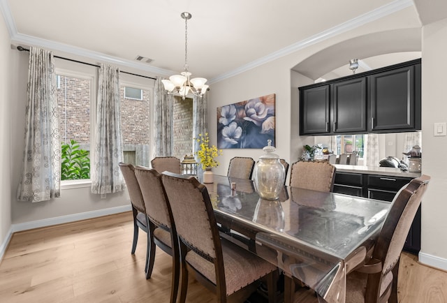 3422 Leaning Willow Dr, Katy, TX 77494 - dining area featuring baseboards, a chandelier, ornamental molding, and visible vents