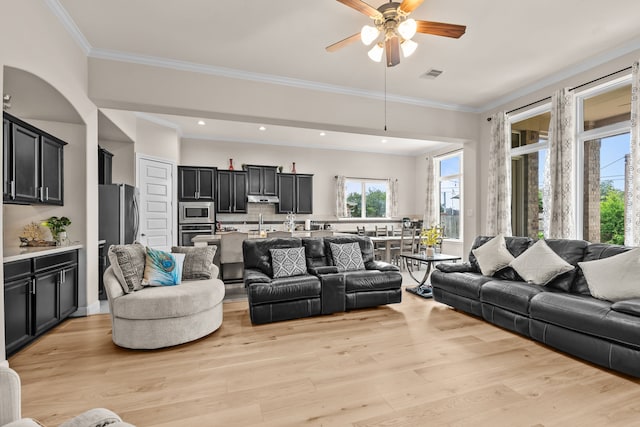 3422 Leaning Willow Dr, Katy, TX 77494 - living room featuring crown molding, ceiling fan, light wood finished floors, recessed lighting, and visible vents