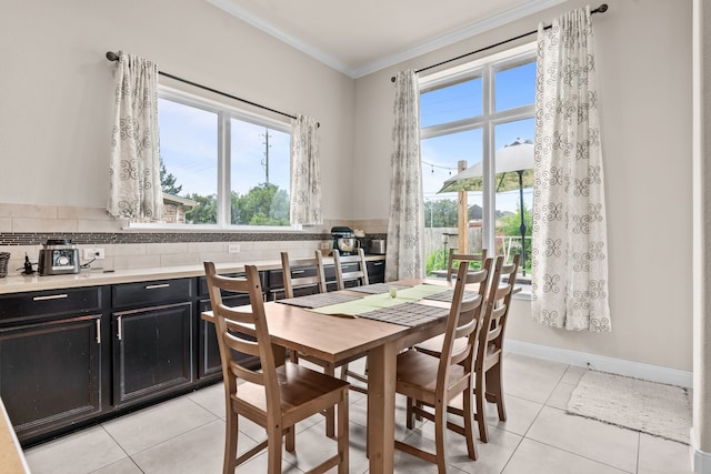 3422 Leaning Willow Dr, Katy, TX 77494 - dining space featuring crown molding, light tile patterned flooring, and a wealth of natural light