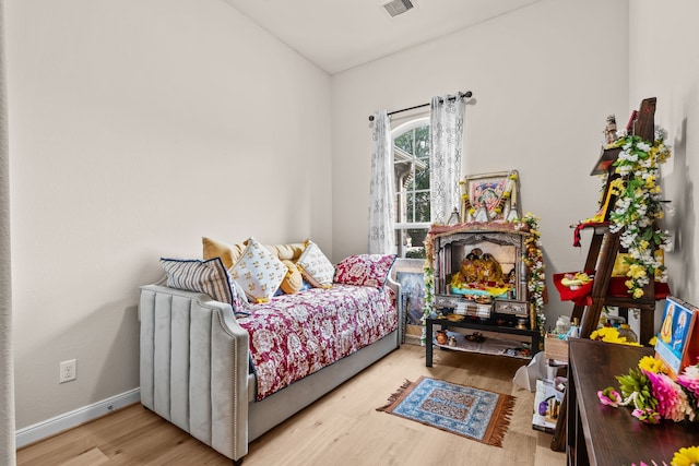 3422 Leaning Willow Dr, Katy, TX 77494 - bedroom with baseboards, wood finished floors, and visible vents