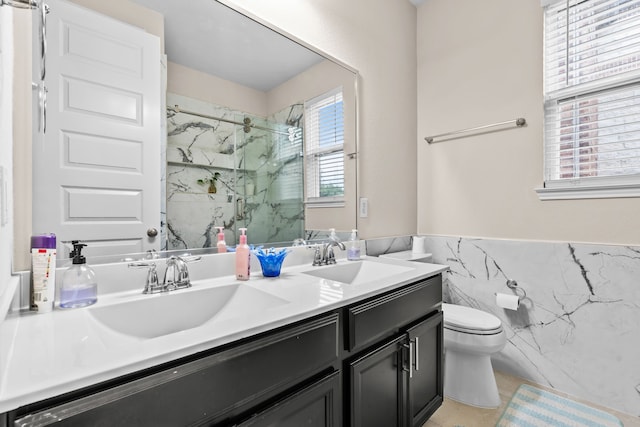 3422 Leaning Willow Dr, Katy, TX 77494 - bathroom featuring a sink, a marble finish shower, toilet, and double vanity