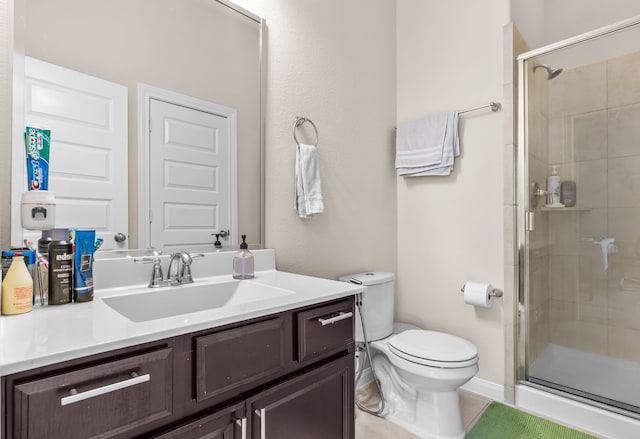 3422 Leaning Willow Dr, Katy, TX 77494 - bathroom with vanity, tile patterned floors, a shower stall, and toilet
