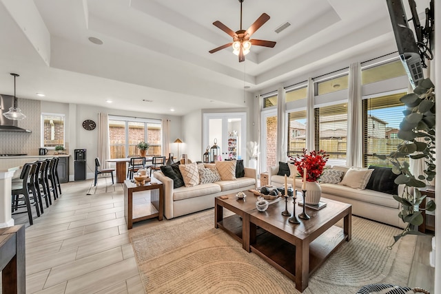 32927 Franklin Brooks Dr, Brookshire, TX 77423 - living area with a ceiling fan, a tray ceiling, recessed lighting, and visible vents