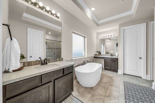 32927 Franklin Brooks Dr, Brookshire, TX 77423 - full bathroom featuring a sink, a freestanding tub, two vanities, a tray ceiling, and a stall shower