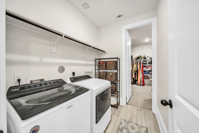 32927 Franklin Brooks Dr, Brookshire, TX 77423 - clothes washing area with baseboards, laundry area, visible vents, and washer and clothes dryer