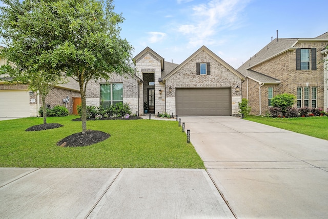 32927 Franklin Brooks Dr, Brookshire, TX 77423 - french country home with an attached garage, a front lawn, and concrete driveway
