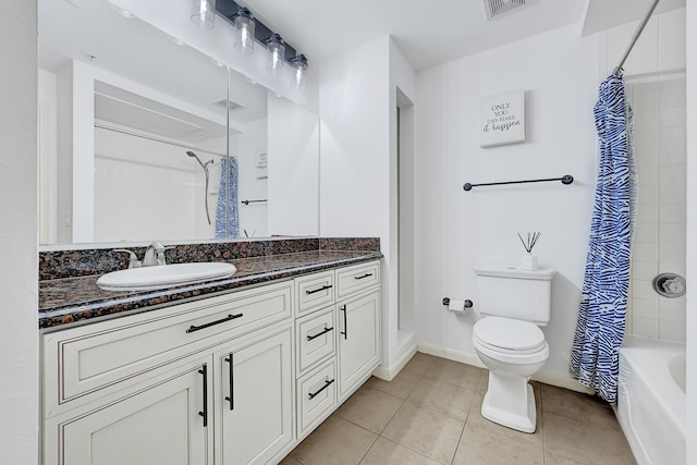 bathroom featuring visible vents, tile patterned floors, toilet, and vanity