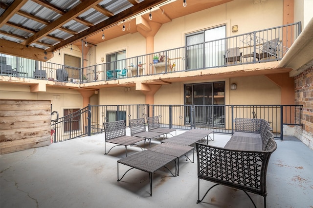 view of patio / terrace with an outdoor living space and a balcony