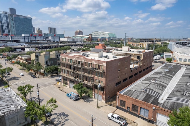 drone / aerial view featuring a city view