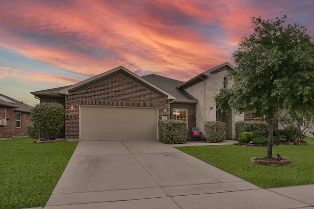 7610 Willow School Dr, Spring, TX 77389 - view of front of property featuring an attached garage, concrete driveway, brick siding, and a front yard
