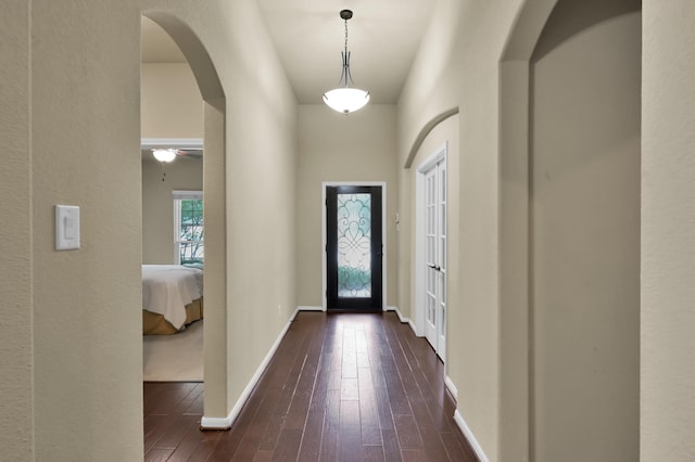 7610 Willow School Dr, Spring, TX 77389 - entrance foyer featuring arched walkways, baseboards, dark wood finished floors, and ceiling fan