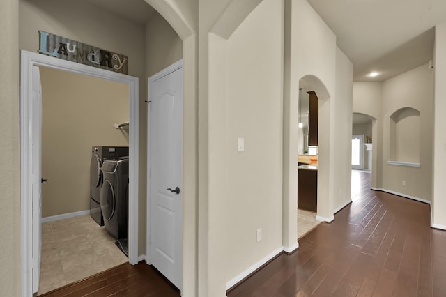 7610 Willow School Dr, Spring, TX 77389 - hallway featuring recessed lighting, arched walkways, dark wood finished floors, and washer and clothes dryer