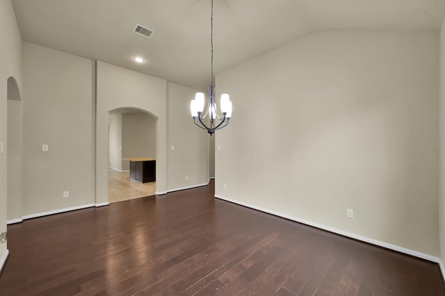 7610 Willow School Dr, Spring, TX 77389 - unfurnished dining area featuring a notable chandelier, arched walkways, baseboards, wood finished floors, and visible vents