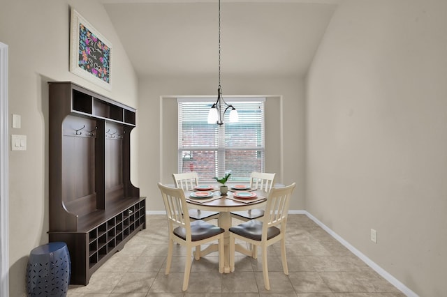 7610 Willow School Dr, Spring, TX 77389 - dining space with light tile patterned floors, baseboards, and lofted ceiling
