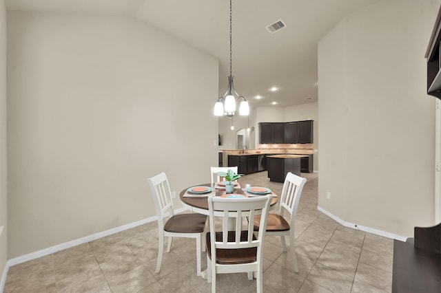 7610 Willow School Dr, Spring, TX 77389 - dining area with visible vents, light tile patterned floors, baseboards, lofted ceiling, and recessed lighting