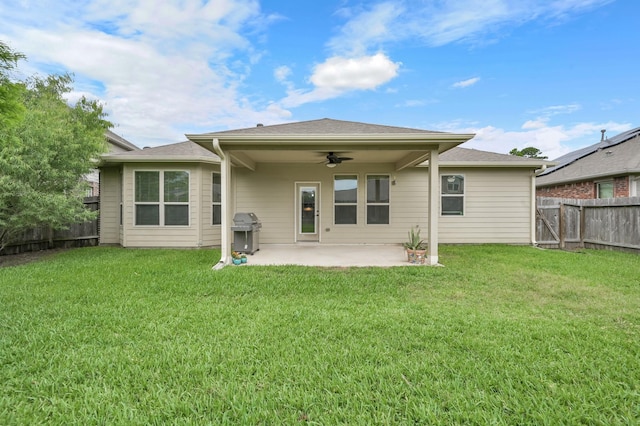 7610 Willow School Dr, Spring, TX 77389 - rear view of property featuring a lawn, a patio, ceiling fan, and a fenced backyard
