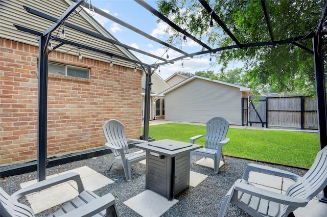 view of patio with a pergola, fence, and a gate