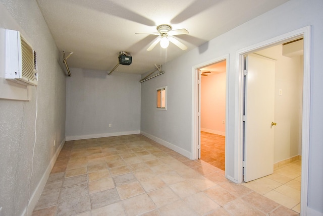 7218 Tours St, Houston, TX 77036 - spare room featuring ceiling fan, light tile patterned floors, and a wall mounted air conditioner
