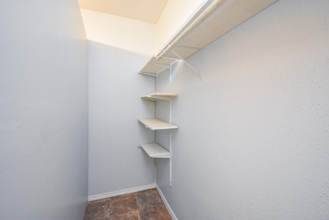7218 Tours St, Houston, TX 77036 - spacious closet featuring stone finish floors