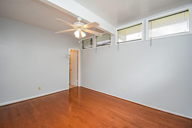 7218 Tours St, Houston, TX 77036 - spare room featuring ceiling fan, wood finished floors, and baseboards