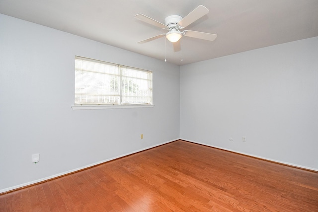 7218 Tours St, Houston, TX 77036 - spare room with a ceiling fan, wood finished floors, and baseboards
