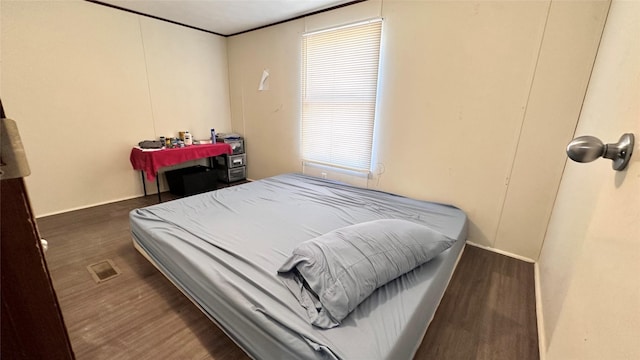 bedroom featuring wood finished floors