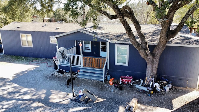 view of front of house featuring a porch and a shingled roof