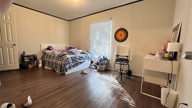 bedroom with wood finished floors