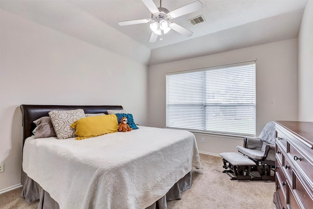 bedroom with a ceiling fan, baseboards, visible vents, and light carpet
