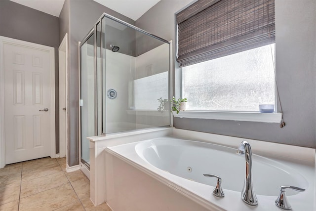 bathroom featuring a garden tub, tile patterned floors, and a stall shower