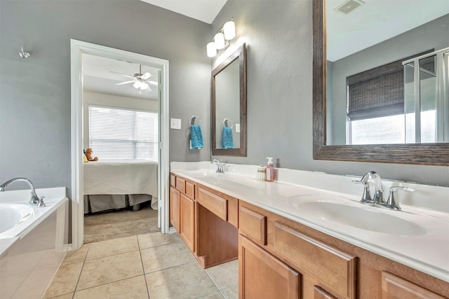 full bathroom featuring a sink, tile patterned floors, a ceiling fan, and visible vents