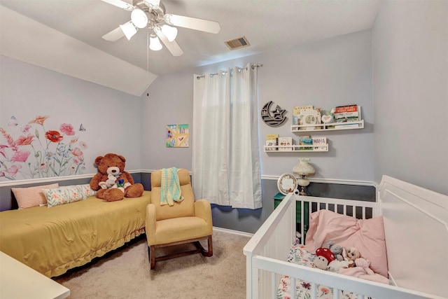 carpeted bedroom featuring visible vents, baseboards, ceiling fan, and vaulted ceiling